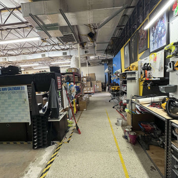 Packing aisle with boxes and equipment at the Laguna Studios warehouse