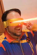 Person wearing a Biclops Track Jacket smiling and striking a superhero pose while using laser vision effect.