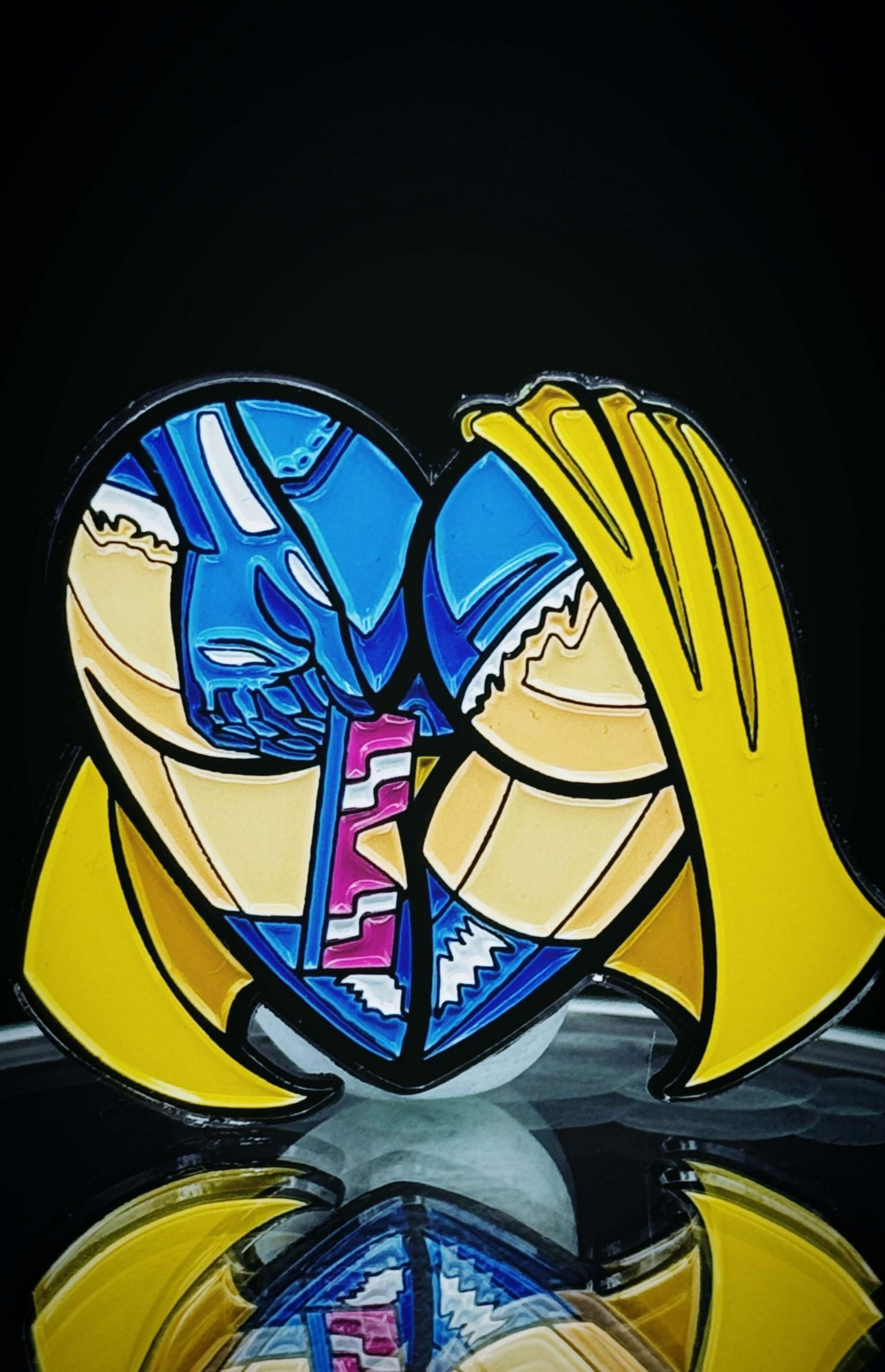 Colorful enamel heart-shaped pin featuring comic-style figures in a playful embrace, perfect for collectors and enthusiasts.