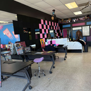 Interior view of a vibrant beauty salon featuring colorful walls and modern equipment.