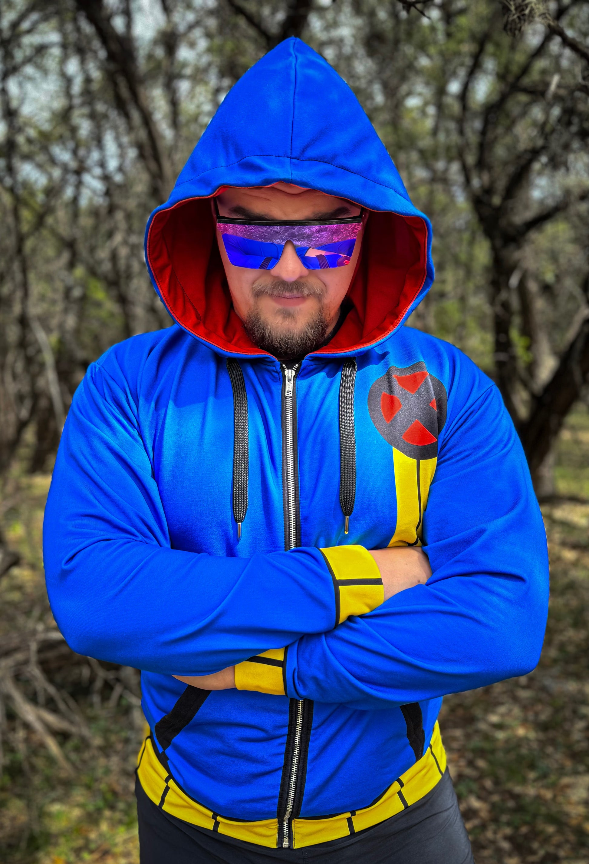 One-Eye Zip-up Hoodie featuring bold blue color and visor-style sunglasses.